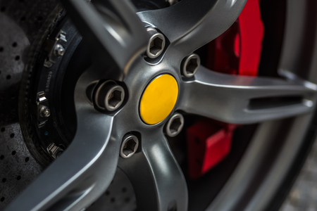 Detail on a wheel car tire of a super sport car, low key photographyの写真素材