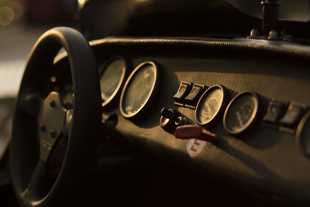 Detail of a Super Sport Car Cockpit   Dashboard with speedometer and gauges in backlight sunset sceneの写真素材