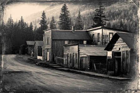 Vintage photo of old western buildings in the middle of mountainsのeditorial素材