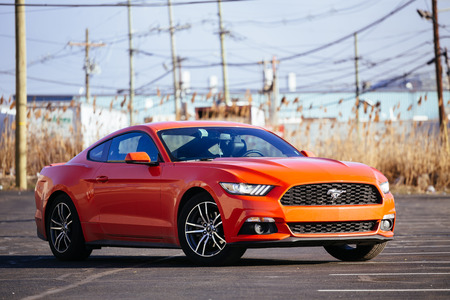 Orange Ford Mustang 2016 on a streetのeditorial素材