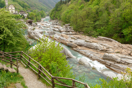 View on the Lavertezzo village, famous tourist destination - An old Swiss village with double arch stone bridge at Ponte dei Salti with waterfall, Lavertezzo, Verzascatal, Canton Tessinの写真素材