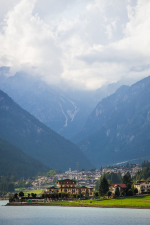 View on  diga di santa caterina with beautiful high mountains in the background covered with cloudsduring a cloudy dayの写真素材