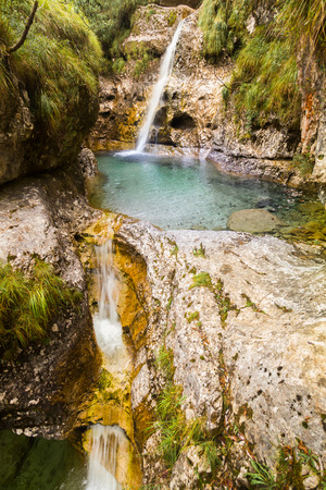 Cadini of Brenton, Sospirolo, Italy with azure clear water and multiple waterfalls along the way downの写真素材