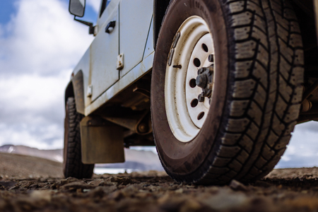 Detail of a black offroad tire on a offroad truck vehicle, built for heavy rides and unpaved roadsの写真素材