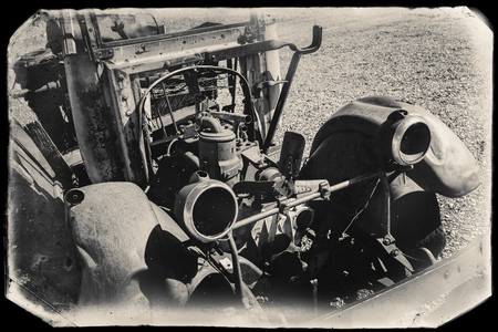 Black and White Sepia Vintage Photo of Old Rusted Car in a junkyard at the Goldfield Ghost Townの写真素材