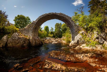Old Pack Horse Bridge in Dulnain Bridge, Carrbridge, Scotland, UKの写真素材