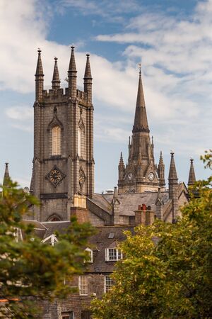 Former South Church with Kirk of St Nicholas (Triple Kirk) in the background surrounded by trees in Aberdeen, Scotland, UKの写真素材