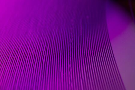 Purple close up macro detail on music vinyl grooves of a single 7 inch record played at 45 rpmの写真素材
