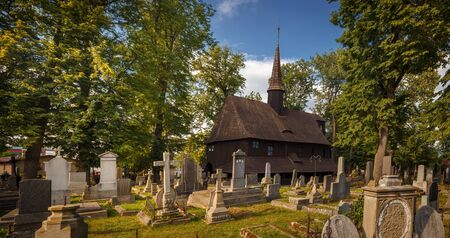 Church of the Virgin Mary in Broumov during beautiful sunny day with blues sky âÂ The oldest wooden church in  Czech Republic and second oldest in Europeの写真素材
