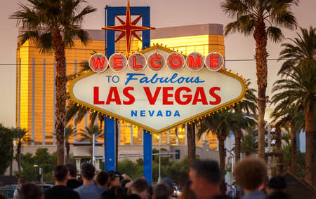 Iconic Sign Welcome to Fabulous Las Vegas in Nevada crowded by people waiting in a long line to pose with the sign and take a photoのeditorial素材