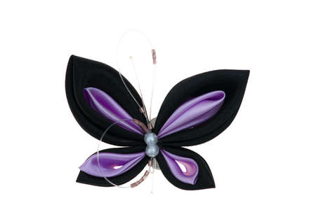 Coloured toy butterfly made of ribbonsの写真素材