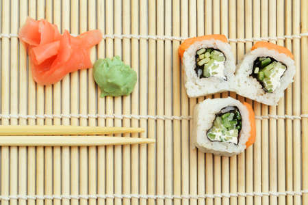 3 pieces of Sushi roll on bamboo matの写真素材