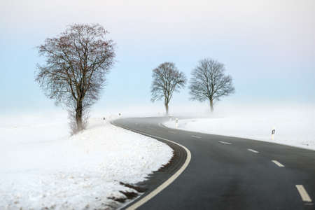 Winding winter roadの写真素材