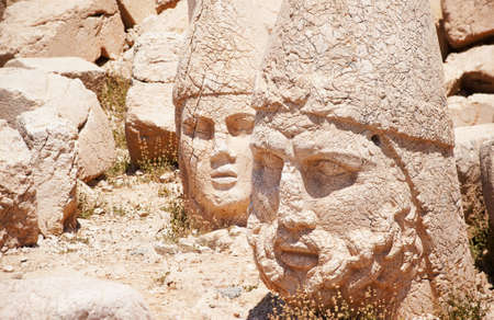 Antique statues on the top of Nemrut mountain, Turkeyの写真素材