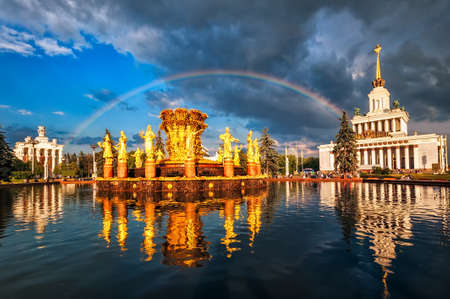 Rainbow over golden fountain and neo classical pavillon at the National Exhibition Center, Moscow, Russiaの写真素材