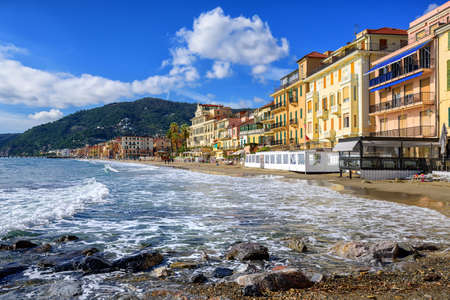 Mediterranean beach promenade in traditional touristic town Alassio on italian Riviera by San Remo, Liguria, Italyの写真素材
