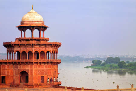 Red corner tower of Taj Mahal complex overlooking the river in Agra, Indiaの写真素材