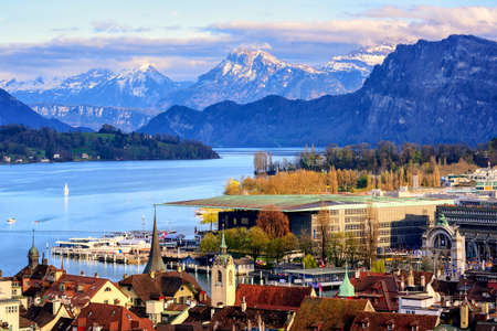Lucerne old town and Culture center building on Lake Lucerne with snow covered Alps mountains in...