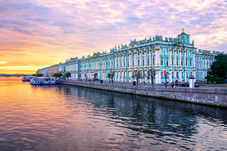 Winter Palace building housing Hermitage museum reflects in Neva river on dramatic sunrise, St Petersburg, Russiaのeditorial素材
