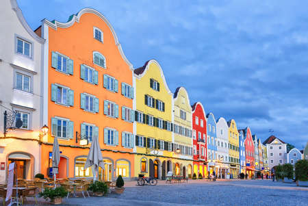 Colorful traditional houses in gothic old town Scharding, Upper Austria, in the evening