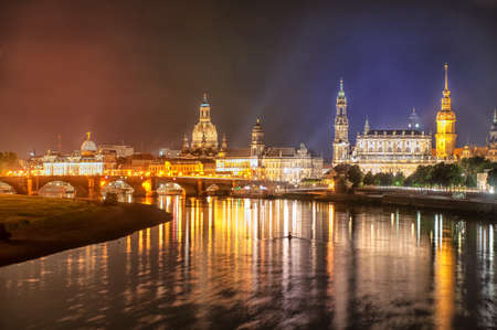 Old town of Dresden with the Castle, Zwinger and Frauenkirche reflecting in Elbe river at night time, Germanyのeditorial素材