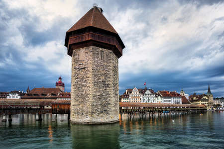 Water Tower and Chapel Bridge in the old town of Lucerne, Switzerlandの写真素材