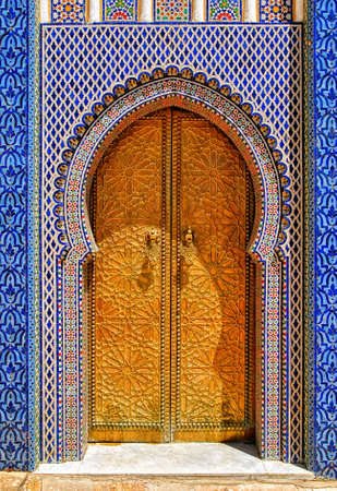 The golden doors and ornamented colorful tiles of Dar el Makhzen, Royal Palace in Fes, Moroccoのeditorial素材