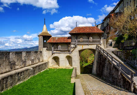 The ramparts, walls and gate of the medieval Old Town of Gruyeres, famous for the gruyere cheese, Switzerlandの写真素材