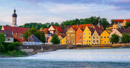 Colorful gothic houses and waterfall in Landsberg on Lech Old Town, Bavaria, Germany
