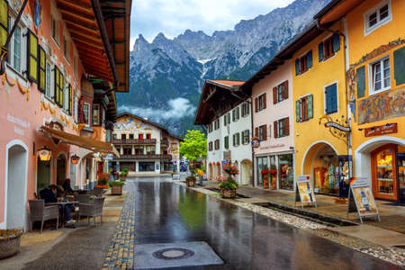 Mittenwald, Germany - 11 July 2019: Colorful painted houses in the Old town of Mittenwald, a popular tourist destination in Alps mountains, Bavariaのeditorial素材
