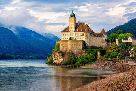 The medieval Schonbuhel castle, built on a rock on Danube river is a main historical landmark and popular tourist attraction in Wachau valleyのeditorial素材
