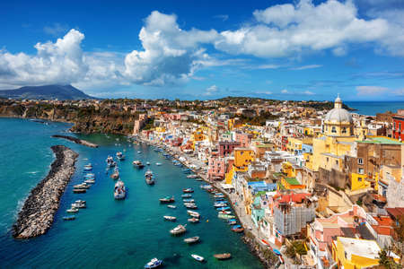 Picturesque fishermen village and port on Procida island in Mediterranean sea, Naples, Italyの写真素材