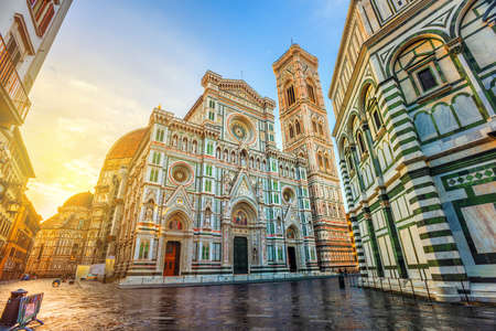 Cathedral of Santa Maria del Fiore with Brunelleschi's Dome, Giotto's Campanile and Baptisterium in Piazza del Duomo, Florence, Italy, in dramatic sunrise lightのeditorial素材