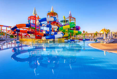 A big colorful inline tube water slide in a poolの写真素材