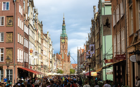 Gdansk, Poland - 09 July 2015: Dluga Street is the main pedestrian street in the Old town center of Gdansk city, Poland, featuring the Town Hall tower and many other prominent landmarksのeditorial素材