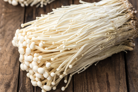 Enoki mushroom, Fresh Golden needle mushroom in plant nursery backgroundの写真素材