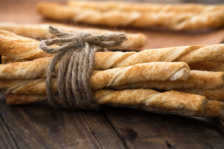 Pie or bread Sticks with rope sack on wood