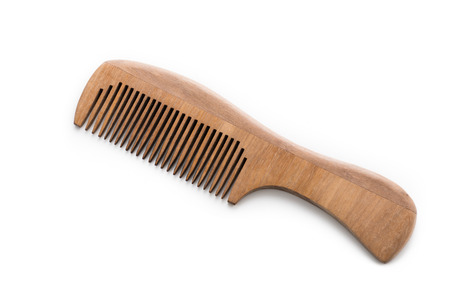 Wood comb on isolated white background