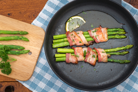 Fresh Young Asparagus Wrapped in Prosciutto Meat and Grilledの写真素材