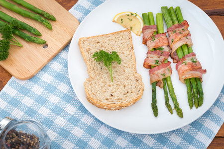 Fresh Young Asparagus Wrapped in Prosciutto Meat and Grilledの写真素材