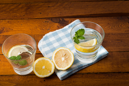 Lemonade with fresh lemon on wooden backgroundの写真素材