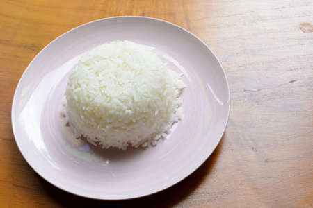 Cooked rice on white dishの写真素材