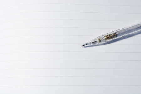 Lined paper with pencilの写真素材