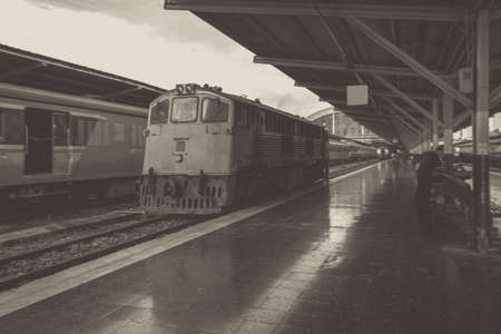 Perspective of train, Diesel locomotive while it moving, on Bangkok railway station platform...