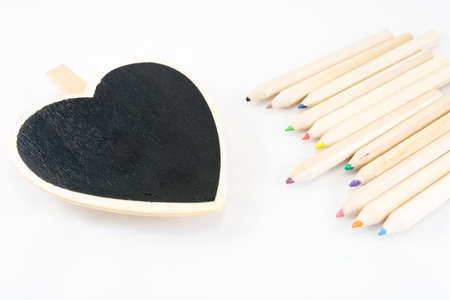 The frame as a heart with color pencil on white backgroundの写真素材
