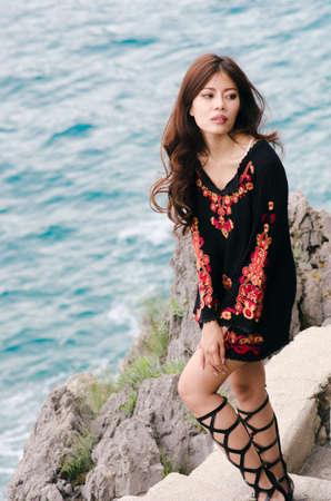 Wild bohemian on the shore
