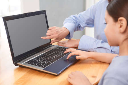 teacher with student doing online lessons, online education concept, online learning with kids at...