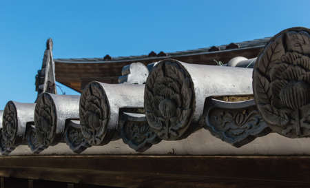 Close up of Asian ceramic style roof tilesの写真素材