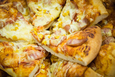 Several slices of pizza stacked on a plateの写真素材