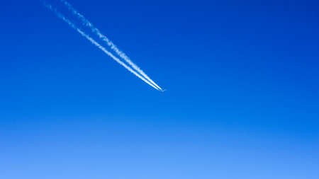 Plane with vapor stripes